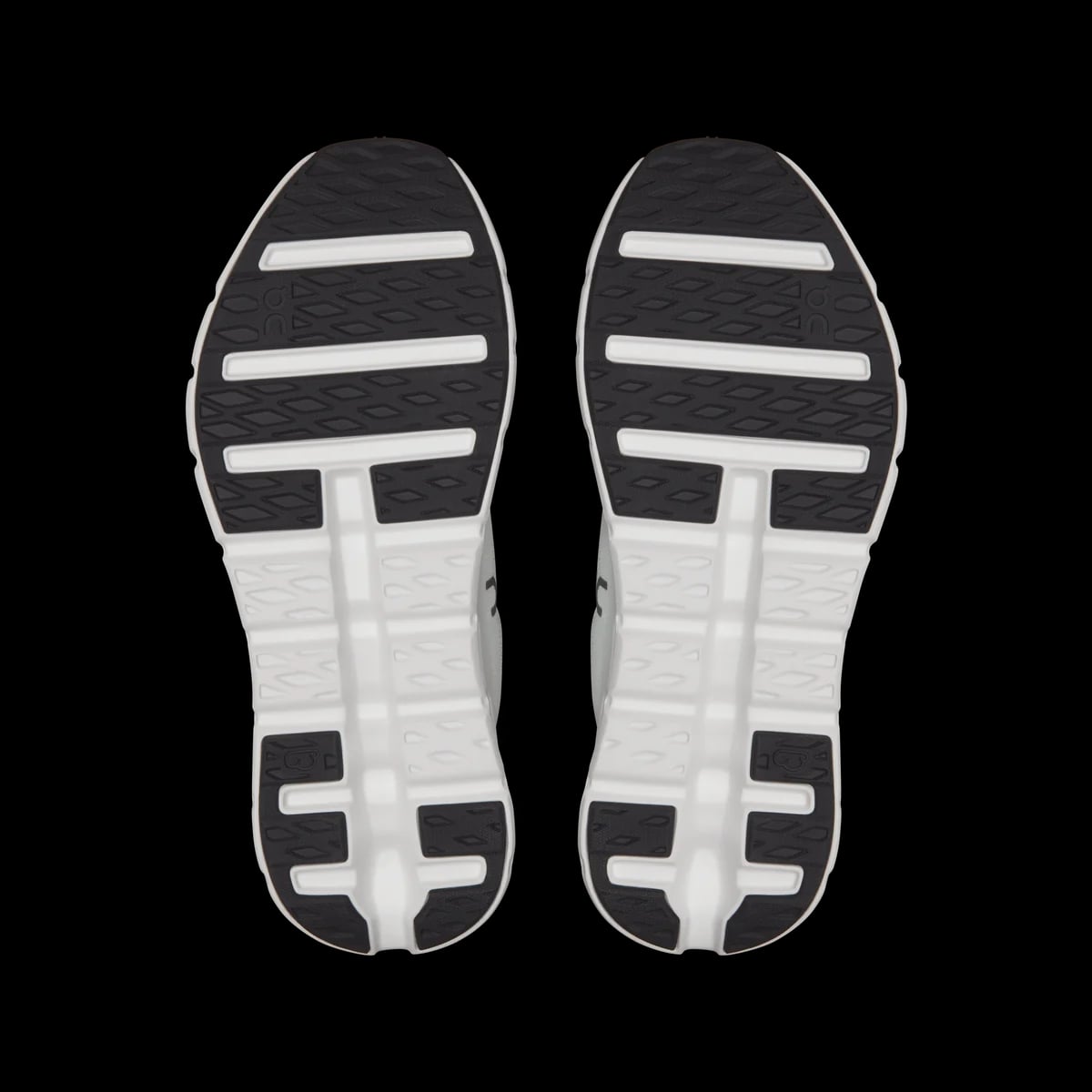 On Cloudtilt — black / ivory — outsole view (official reference photograph)