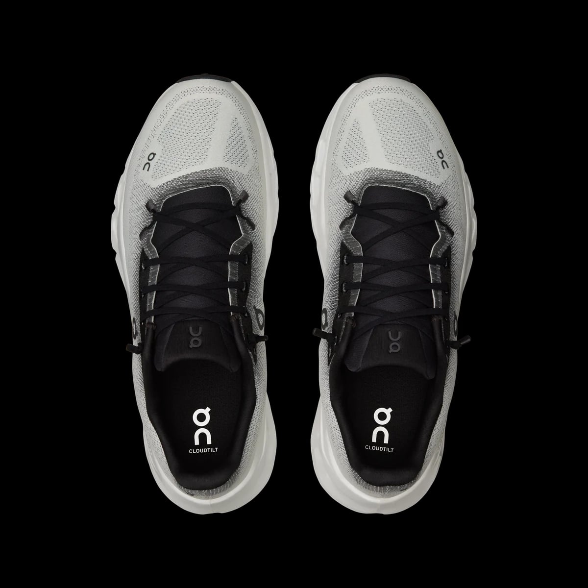 On Cloudtilt — black / ivory — top view (official reference photograph)