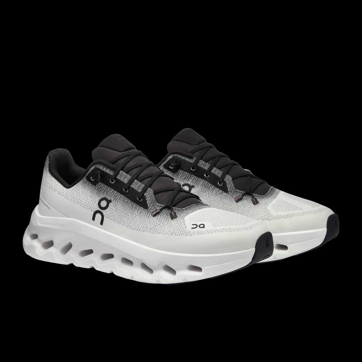 On Cloudtilt — black / ivory — pair view (official reference photograph)